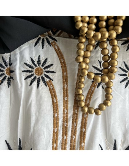 Falda midi detalles soles bordados