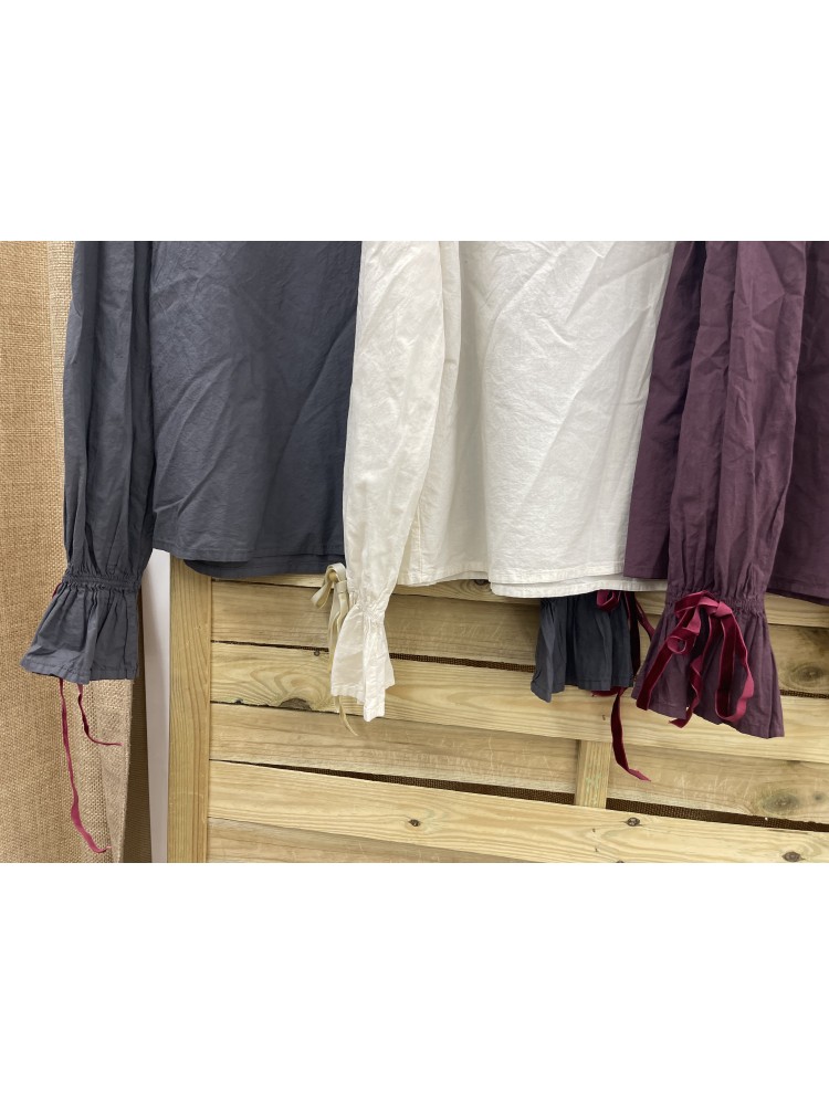 Camisa capa redondeada y lazo en puños